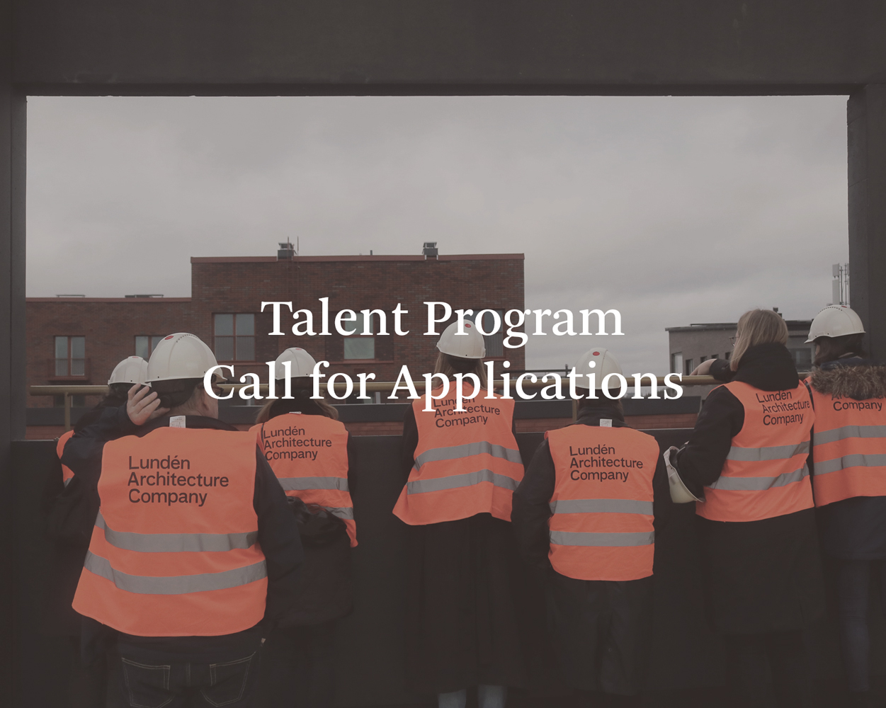 Several people in safety vests and helmets looking out of an opening with their backs turned to the camera, text over the photo says Talent Program Call for Applications